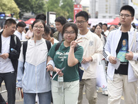 Students are walking into a test room outside Qingjiang Middle School College entrance examination site of the 2024 National College Entranc...