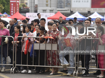 Students are walking into a test room outside Qingjiang Middle School College entrance examination site of the 2024 National College Entranc...