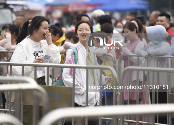 Students are walking into a test room outside Qingjiang Middle School College entrance examination site of the 2024 National College Entranc...