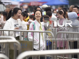 Students are walking into a test room outside Qingjiang Middle School College entrance examination site of the 2024 National College Entranc...