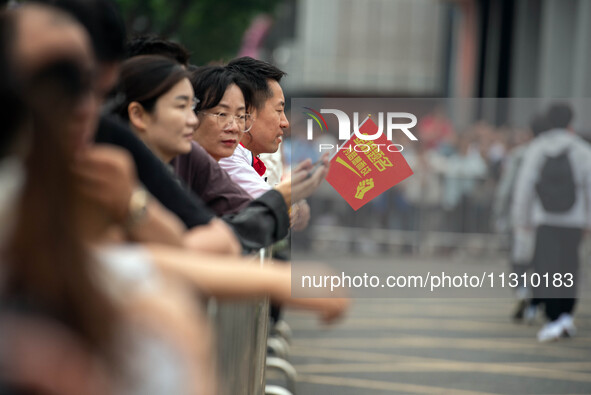 Students are walking into a test room outside Qingjiang Middle School College entrance examination site of the 2024 National College Entranc...