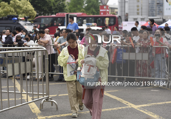 Students are walking into a test room outside Qingjiang Middle School College entrance examination site of the 2024 National College Entranc...