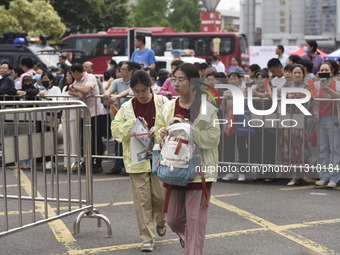 Students are walking into a test room outside Qingjiang Middle School College entrance examination site of the 2024 National College Entranc...