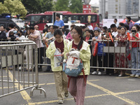 Students are walking into a test room outside Qingjiang Middle School College entrance examination site of the 2024 National College Entranc...