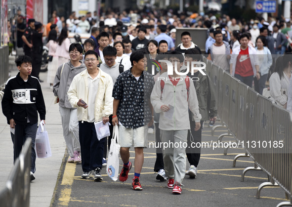 Students are walking into a test room outside Qingjiang Middle School College entrance examination site of the 2024 National College Entranc...