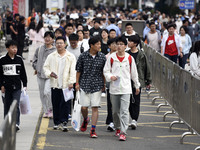 Students are walking into a test room outside Qingjiang Middle School College entrance examination site of the 2024 National College Entranc...