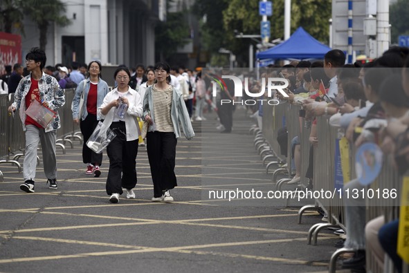 Students are walking into a test room outside Qingjiang Middle School College entrance examination site of the 2024 National College Entranc...