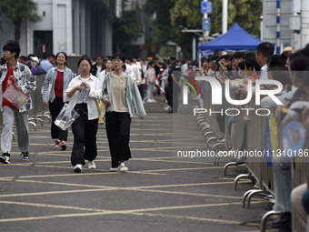 Students are walking into a test room outside Qingjiang Middle School College entrance examination site of the 2024 National College Entranc...