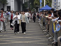 Students are walking into a test room outside Qingjiang Middle School College entrance examination site of the 2024 National College Entranc...