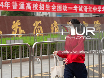 Students are walking into a test room outside Qingjiang Middle School College entrance examination site of the 2024 National College Entranc...