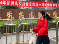 Students are walking into a test room outside Qingjiang Middle School College entrance examination site of the 2024 National College Entranc...