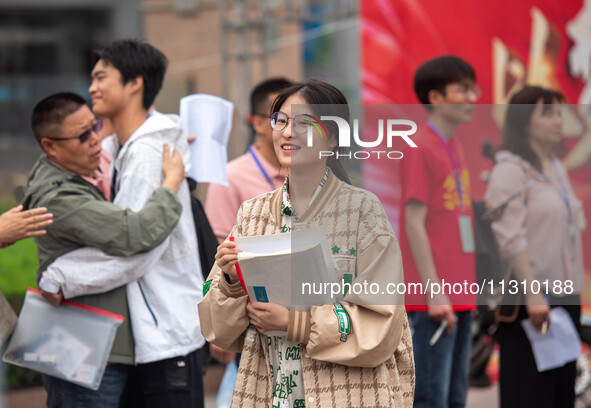 Students are walking into a test room outside Qingjiang Middle School College entrance examination site of the 2024 National College Entranc...