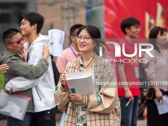 Students are walking into a test room outside Qingjiang Middle School College entrance examination site of the 2024 National College Entranc...