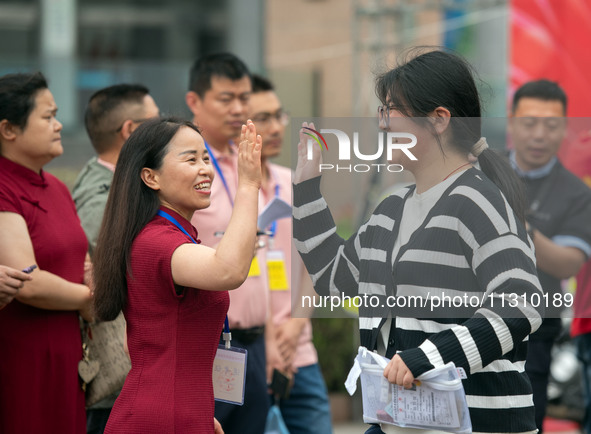 Students are walking into a test room outside Qingjiang Middle School College entrance examination site of the 2024 National College Entranc...