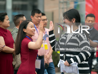 Students are walking into a test room outside Qingjiang Middle School College entrance examination site of the 2024 National College Entranc...