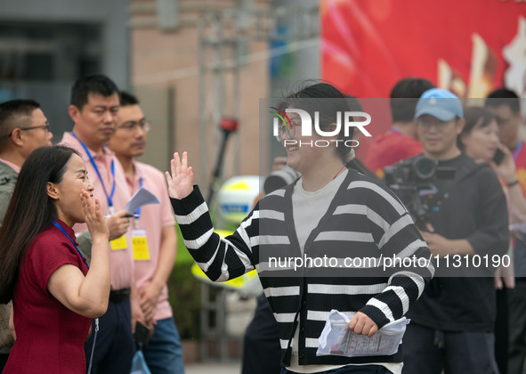 Students are walking into a test room outside Qingjiang Middle School College entrance examination site of the 2024 National College Entranc...