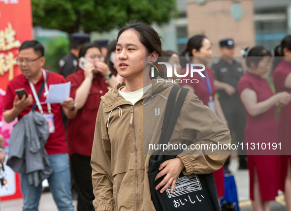 Students are walking into a test room outside Qingjiang Middle School College entrance examination site of the 2024 National College Entranc...