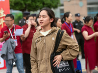 Students are walking into a test room outside Qingjiang Middle School College entrance examination site of the 2024 National College Entranc...