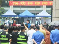 A large number of parents are greeting students coming out of a gaokao site after the 2024 National College Entrance exam in Hangzhou, China...