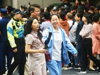 A large number of parents are greeting students coming out of a gaokao site after the 2024 National College Entrance exam in Hangzhou, China...