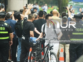 A large number of parents are greeting students coming out of a gaokao site after the 2024 National College Entrance exam in Hangzhou, China...