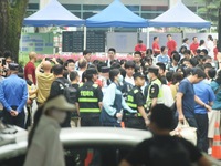 A large number of parents are greeting students coming out of a gaokao site after the 2024 National College Entrance exam in Hangzhou, China...