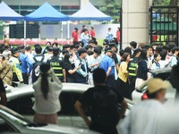 A large number of parents are greeting students coming out of a gaokao site after the 2024 National College Entrance exam in Hangzhou, China...