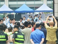 A large number of parents are greeting students coming out of a gaokao site after the 2024 National College Entrance exam in Hangzhou, China...