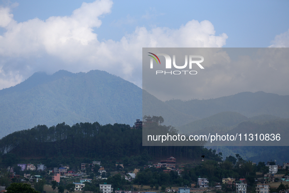 The Santaneshwor Temple, a Hindu temple, is standing tall surrounded by trees in the outskirts of Lalitpur, Nepal, on June 7, 2024. 