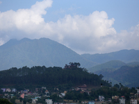 The Santaneshwor Temple, a Hindu temple, is standing tall surrounded by trees in the outskirts of Lalitpur, Nepal, on June 7, 2024. (