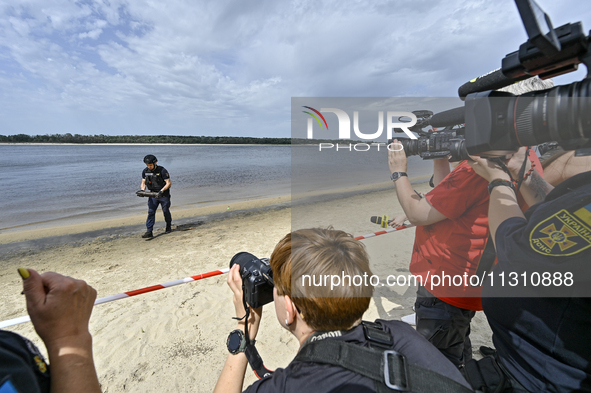 Journalists are filming the head of the Special Pyrotechnics Department of the Main Directorate of the State Emergency Service in Zaporizhzh...