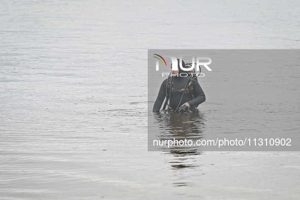 A diver is exploring the bottom of the Dnipro River during the training of State Emergency Service personnel to improve their skills in sear...