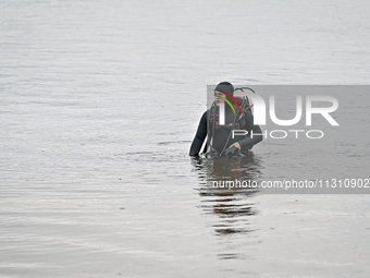 A diver is exploring the bottom of the Dnipro River during the training of State Emergency Service personnel to improve their skills in sear...