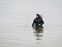 A diver is exploring the bottom of the Dnipro River during the training of State Emergency Service personnel to improve their skills in sear...