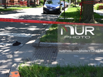 Shoes, blood, and clothing are being found at the crime scene. Two people are being shot in Chicago, Illinois, United States, on June 7, 202...