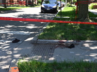 Shoes, blood, and clothing are being found at the crime scene. Two people are being shot in Chicago, Illinois, United States, on June 7, 202...