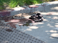 Shoes, blood, and clothing are being found at the crime scene. Two people are being shot in Chicago, Illinois, United States, on June 7, 202...