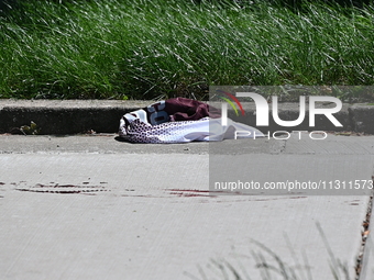 Shoes, blood, and clothing are being found at the crime scene. Two people are being shot in Chicago, Illinois, United States, on June 7, 202...