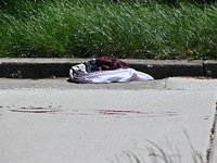 Shoes, blood, and clothing are being found at the crime scene. Two people are being shot in Chicago, Illinois, United States, on June 7, 202...