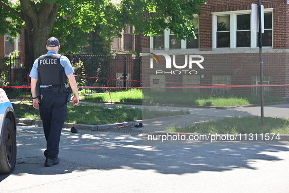 Shoes, blood, and clothing are being found at the crime scene. Two people are being shot in Chicago, Illinois, United States, on June 7, 202...