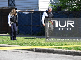 Chicago police are gathering at the crime scene and investigating the shooting that is seriously injuring a 55-year-old man in Chicago, Illi...