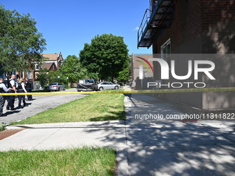 Chicago police are gathering at the crime scene and investigating the shooting that is seriously injuring a 55-year-old man in Chicago, Illi...