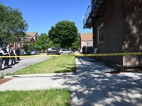 Chicago police are gathering at the crime scene and investigating the shooting that is seriously injuring a 55-year-old man in Chicago, Illi...