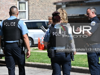 Chicago police are gathering at the crime scene and investigating the shooting that is seriously injuring a 55-year-old man in Chicago, Illi...