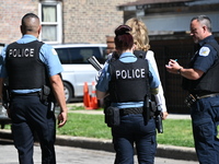 Chicago police are gathering at the crime scene and investigating the shooting that is seriously injuring a 55-year-old man in Chicago, Illi...