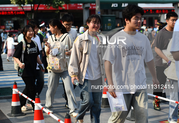 Candidates are lining up to enter a test room to take the National college entrance examination at a college entrance examination site in Fu...