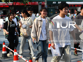 Candidates are lining up to enter a test room to take the National college entrance examination at a college entrance examination site in Fu...