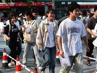 Candidates are lining up to enter a test room to take the National college entrance examination at a college entrance examination site in Fu...