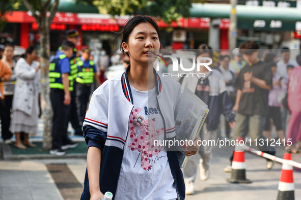 Candidates are lining up to enter a test room to take the National college entrance examination at a college entrance examination site in Fu...