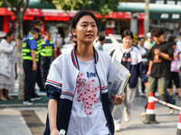 Candidates are lining up to enter a test room to take the National college entrance examination at a college entrance examination site in Fu...